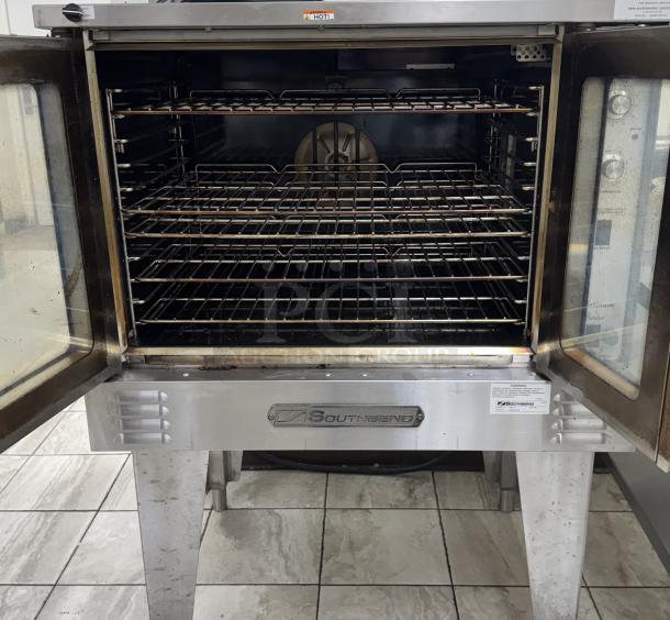 Southbend convection oven, model PCR-1E, tested and working. Less than 3 months old. Open doors reveal interior racks.