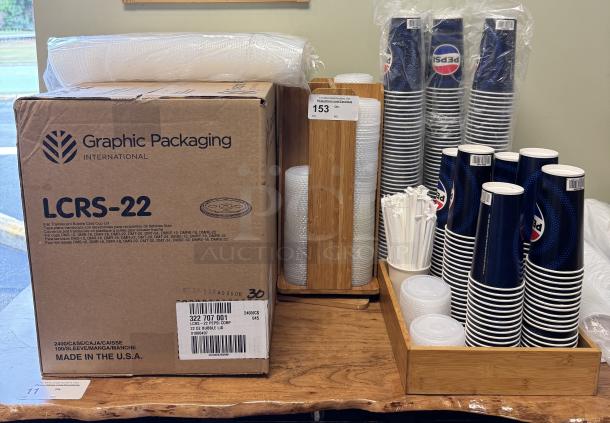 Pepsi cups and lids with wooden holders. Includes 5 sleeves of cups. Box labeled "Graphic Packaging LCRS-22." Made in USA.
