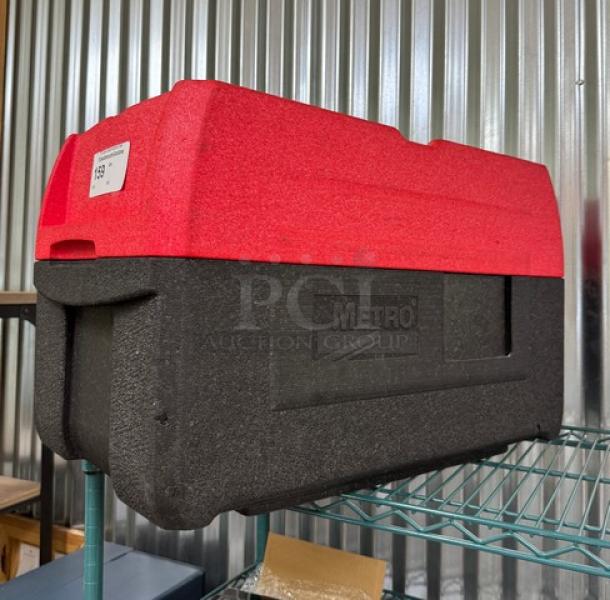 Red and black Portable Metro Cooler in excellent condition, features sturdy build and insulating materials, ideal for transport.