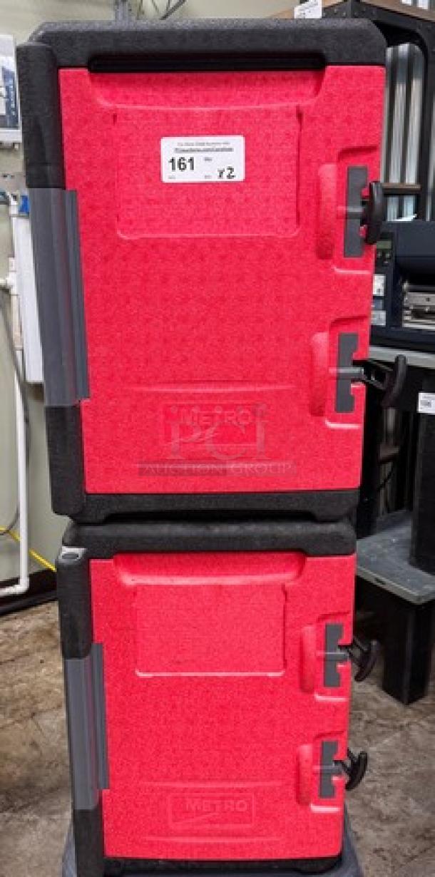 Red Metro portable warming box on dollie, double-stacked, durable handles, visible Metro branding, in good condition.