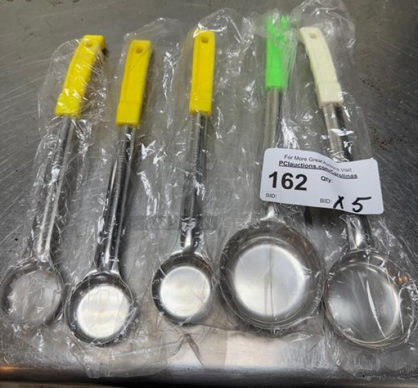 Set of five new serving spoons, assorted sizes, with colorful handles. Item tagged "162," bid quantity x 5.