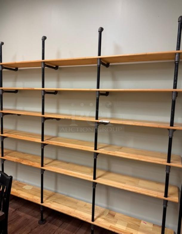 Wood and metal wall unit with shelves featuring black metal supports and multiple wooden shelves. Excellent condition.