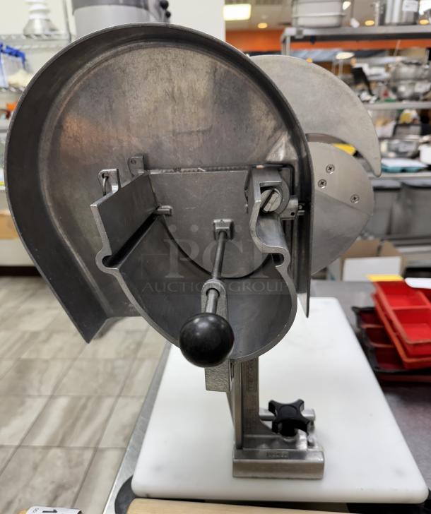 Nemco slicer and cutting board, stainless steel, features adjustable blade. Appears in good condition, mounted on a white board.