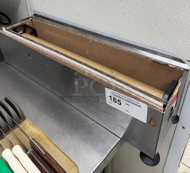 Metal plastic wrap holder and cutter with cardboard dispenser. Shows wear, numbered label "185" attached for auction.