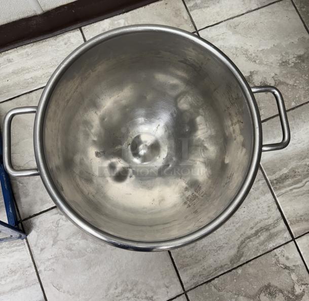 Stainless steel 32 Qt. bowl with side handles, used condition, minor surface scratches visible.