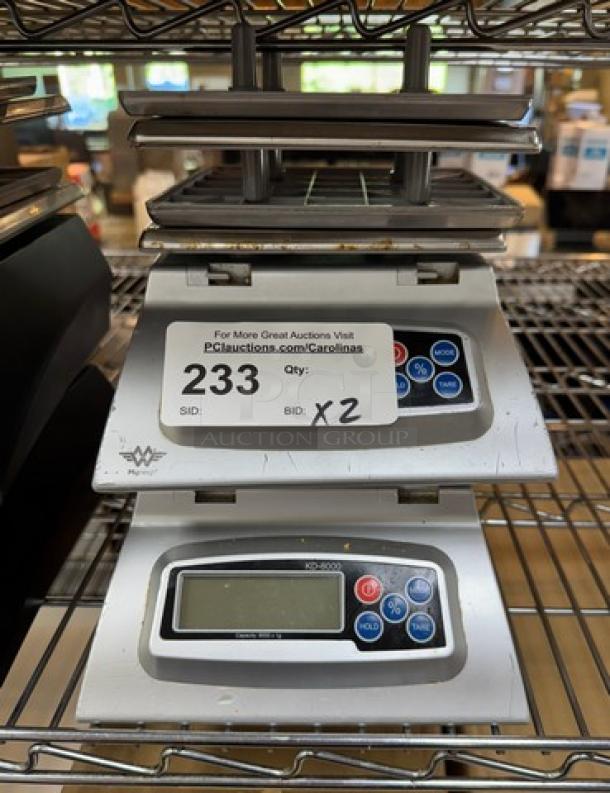 Myweigh Digital Scales, Model #KB8000, set of two. Features include button controls and digital display. Used condition.