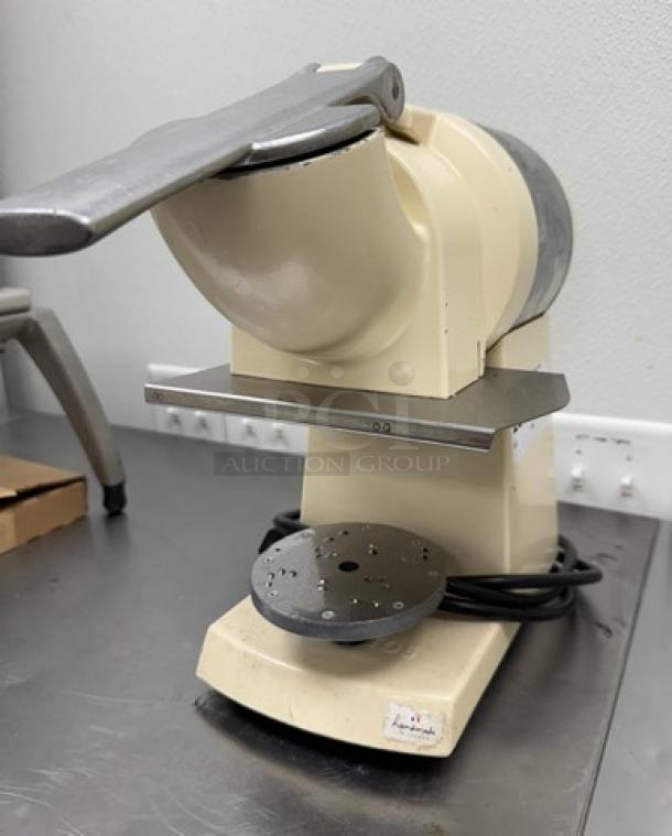 Santos Heavy Duty Grater, cream color, metal components, used condition, featuring power cord and safety lever.