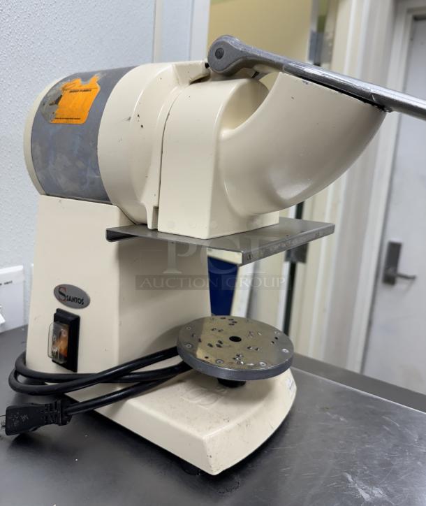 Santos Heavy Duty Grater, cream color, metal chute, visible logo, and on/off switch. Moderate wear, attached cord.