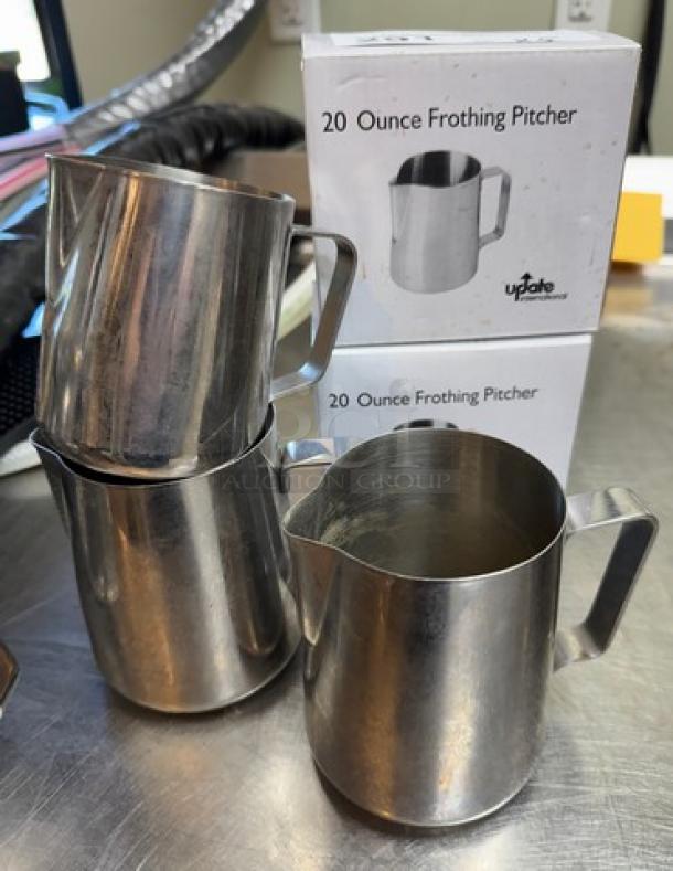 Five 20 oz frothing pitchers, two new in box, stainless steel, used for steaming milk, branded UpDate.