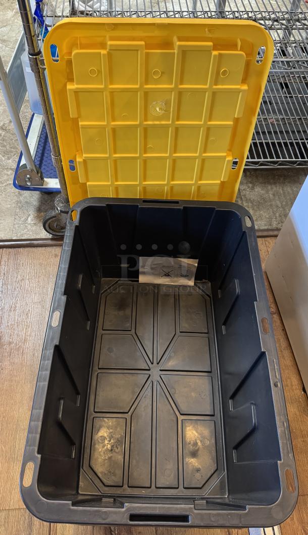 Tough Boy 27 Gal. Construction Grade Storage Container, black with yellow lid. Lid detached, showing spacious interior.