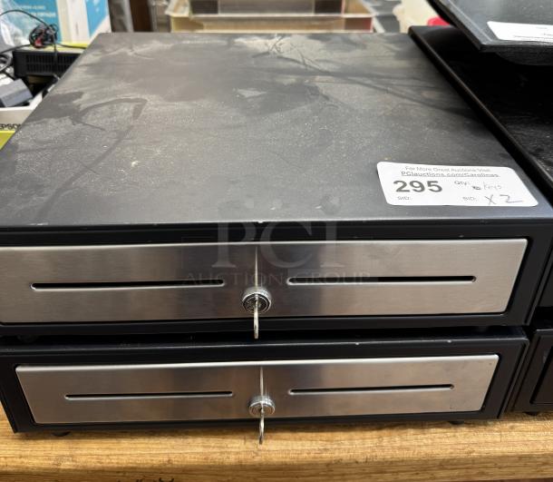 Cash box with two drawers, keys visible in locks, black and silver finish, item tag reads "Qty: 2 Keys."