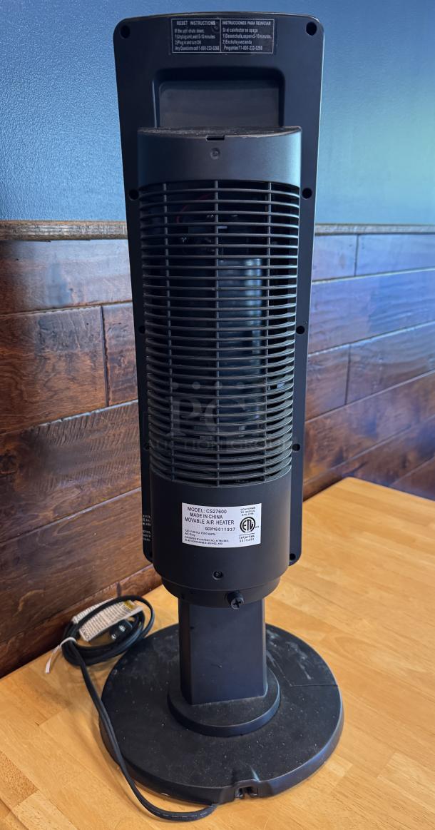 Lasko Portable Heater, Model CS27600, black, upright design, visible power cord, reset instructions on label, used condition.