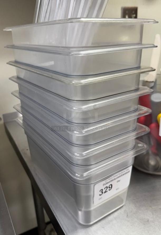 Stack of Virgo acrylic pans with lids, six units. Excellent condition. Auction tag shows number 329.