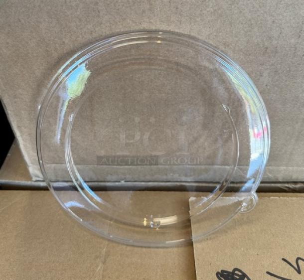 Clear plastic lid, 8.5" diameter, transparent, flexible, new condition, shown against a cardboard background.