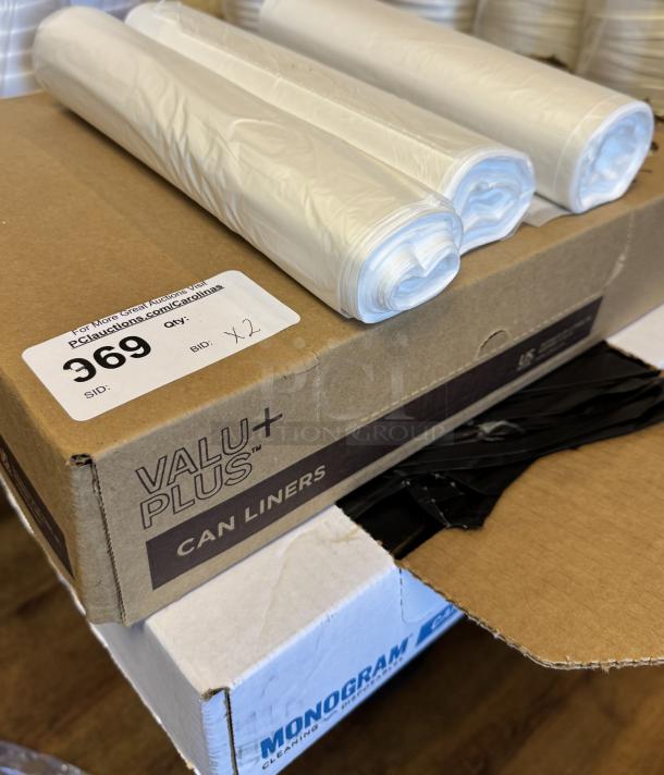 ValuPlus trash can liners in box, 2 bids. Rolls of liners on top. Auction label with lot number 969 visible.