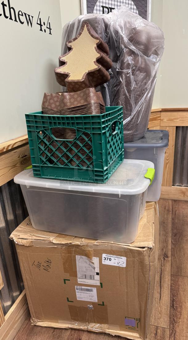 Christmas tree-shaped baking molds in good condition, stacked in a green plastic crate. Box markings read "Tree Molds."