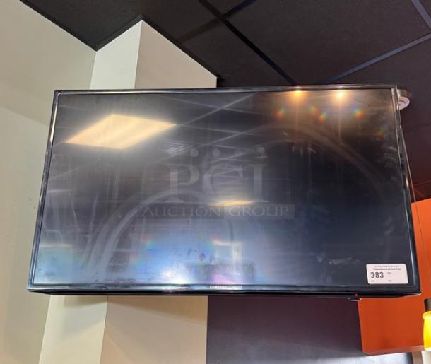 Samsung 48" TV with wall mount, remote included, tested and working. Good condition, model label visible.