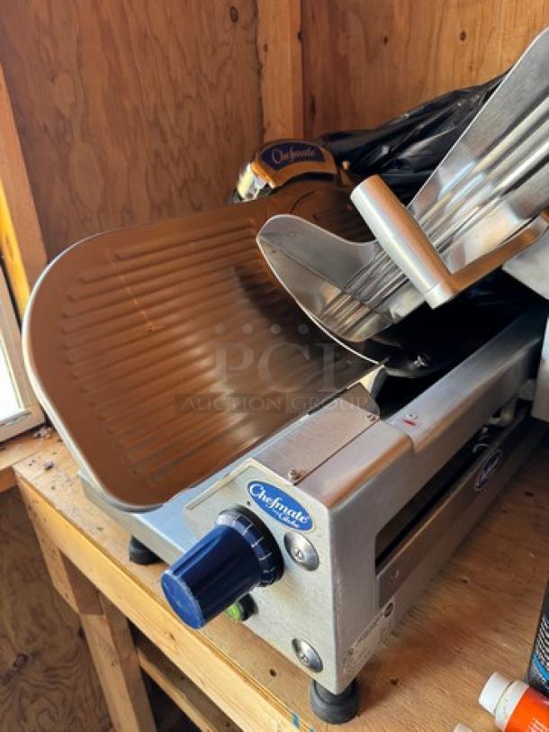 Chefmate Globe Slicer, tested and working, shown on a wooden surface. Features a blue knob and branded labels.