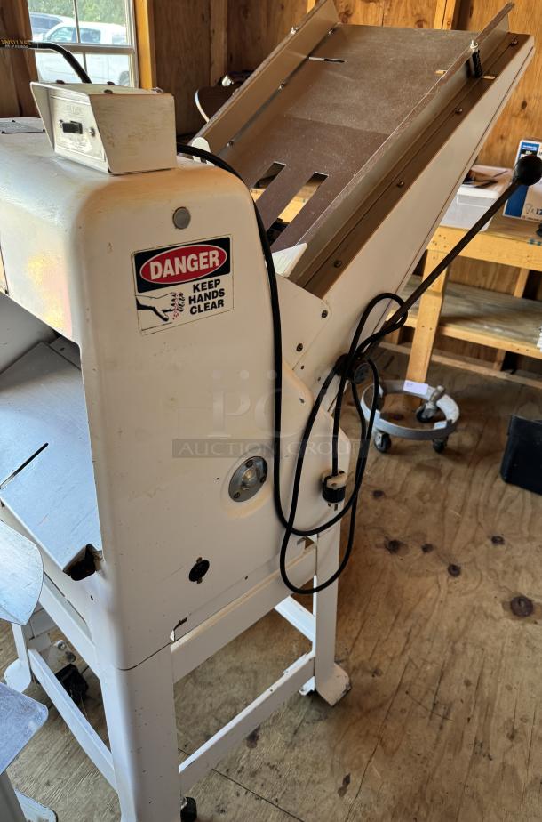 Oliver Gravity Feed Bread Slicer Model 797-32 on casters; tested working condition. Includes safety warning label.