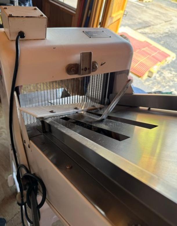 Oliver Gravity Feed Bakery Bread Slicer Model 797-32, on casters, tested and working, featuring stainless steel components.