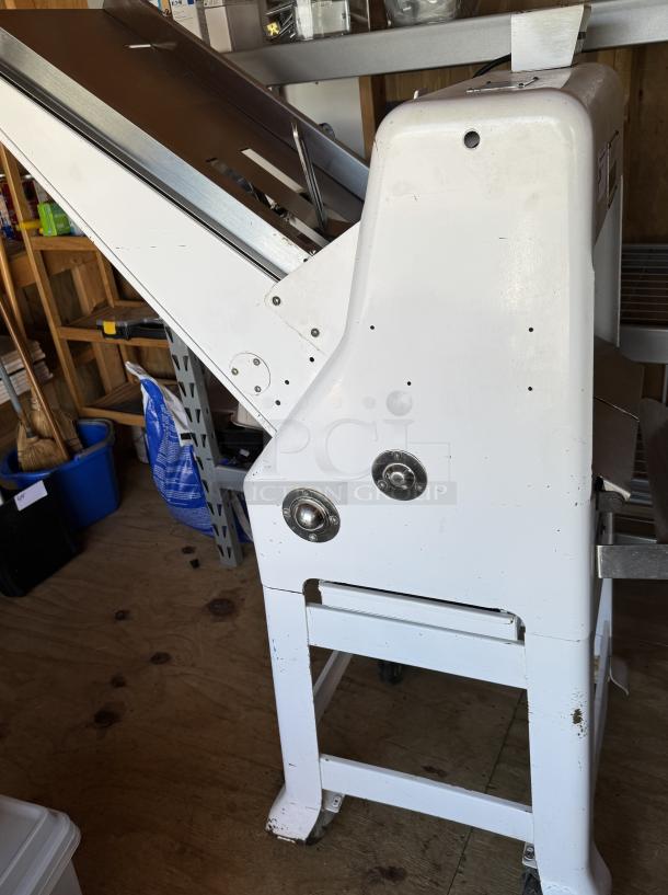 Oliver 797-32 gravity feed bread slicer on casters, tested and working, white metal, visible wear, perfect for bakeries.