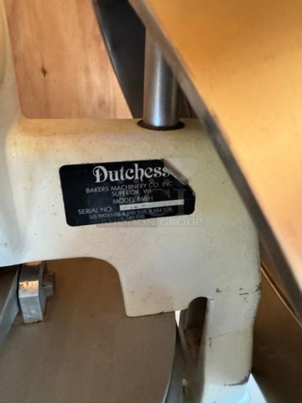 Duchess Dough Press on casters, Model BMIH, cream finish, visible wear, nameplate with serial and patent numbers displayed.
