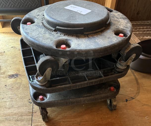 Stack of three trash can dollies with swivel casters, visible wear, and white label marked "408 x3" on top.
