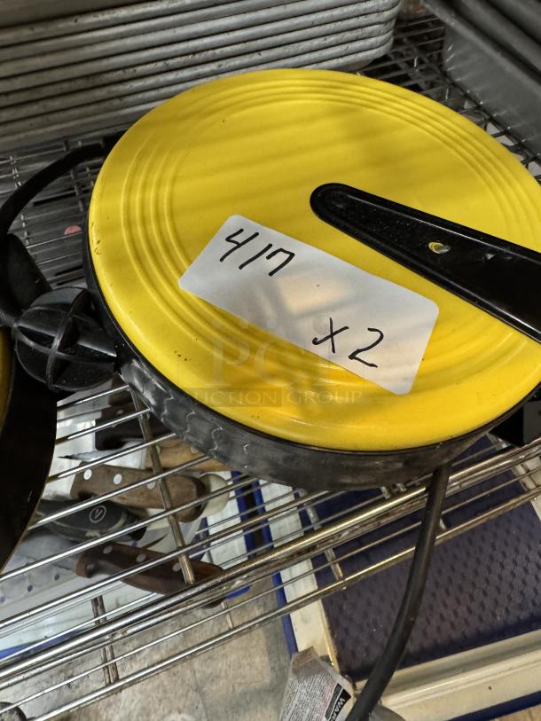 Bayco Model 800 heavy duty extension cord reels, yellow with black handle, includes bid tag labeled "417 x 2."