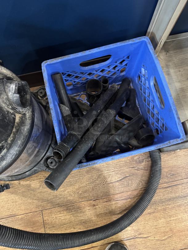 Craftsman 40HP 5 Gal. Wet/Dry Vac, black with accessories, used condition, includes hose and various attachments in a blue crate.