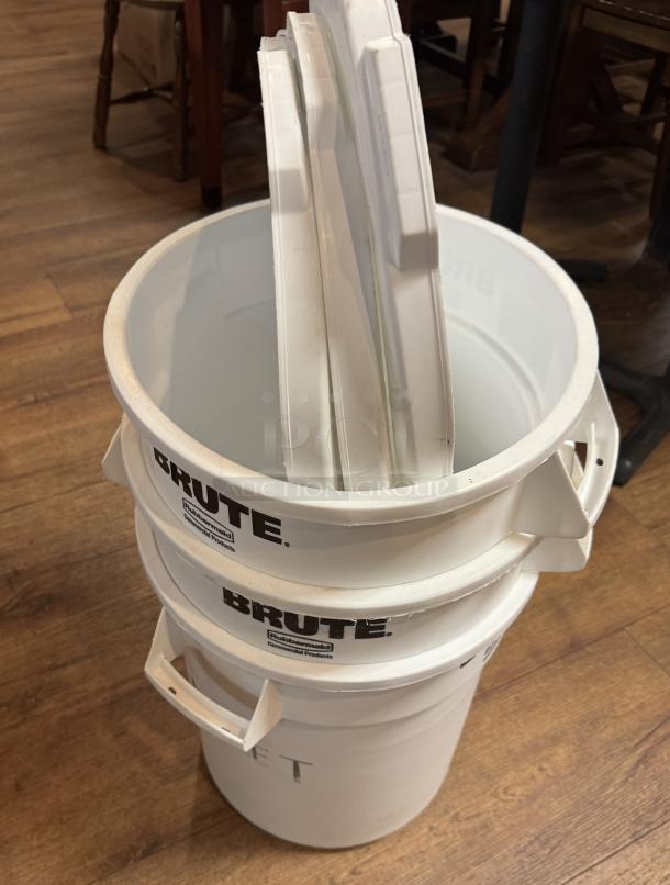 Rubbermaid Brute 10 Gal storage containers with lids, white, used condition. Labeled "BRUTE" with side handles.