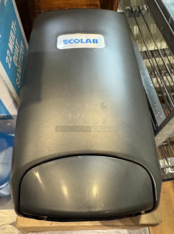Ecolab hand soap dispenser, new condition, with Monogram 22 Multi-Quat Sanitizer and foam hand soap visible.