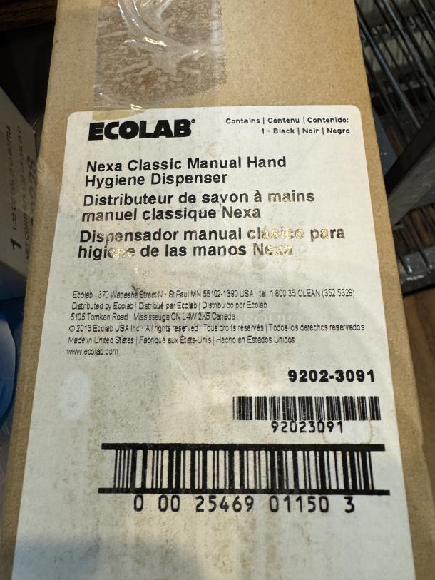 Ecolab Nexa Classic Manual Hand Hygiene Dispenser in box, model 9202-3091, marked for black color.