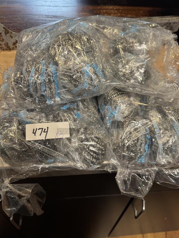 Monogram Stainless Scrubbers, 3 packs. New condition, in plastic wrap. Label reads "474 x3."