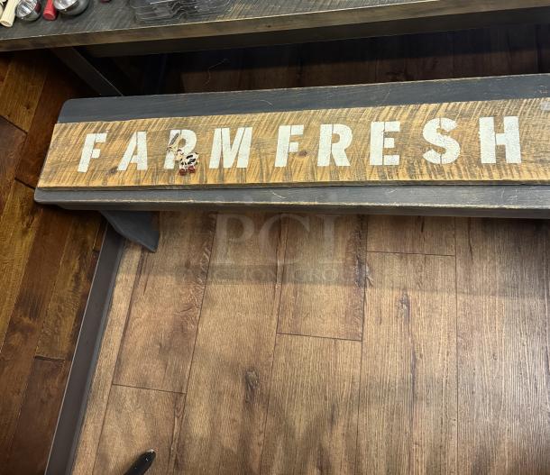 Farm Fresh wooden sign with distressed lettering on rustic wood. Appears in good condition.