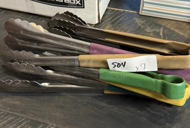 Assorted metal tongs, set of 7, colorful rubber grips. Marked "Sheridan, U.S.A." with a visible auction tag "504 x 7."