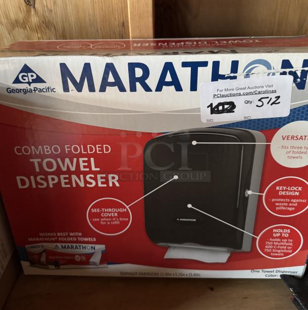 New Marathon Combo Folded Towel Dispenser, in box. Features key-lock design, see-through cover, holds up to 750 towels.