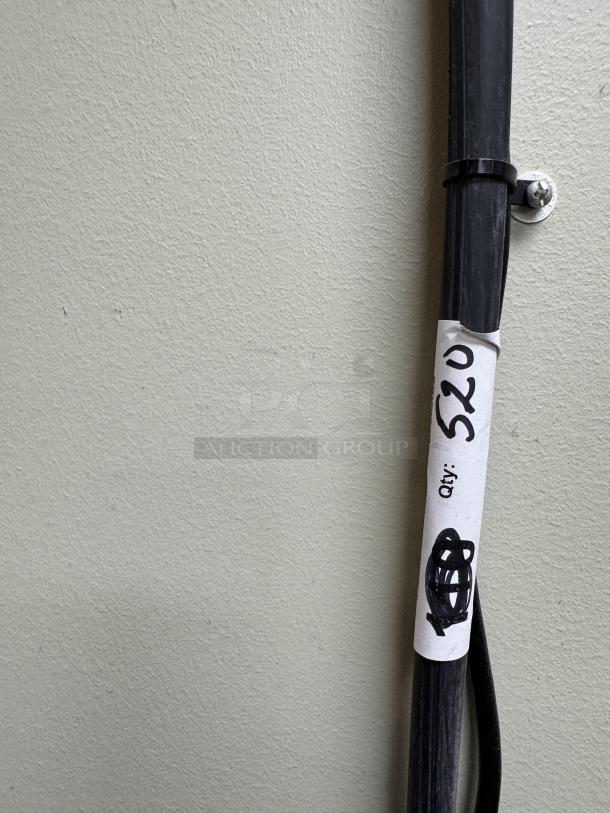 Milton Drive Thru Signal Bell, black rubber hose with attached white label reading "$20 qty/1," in used condition.