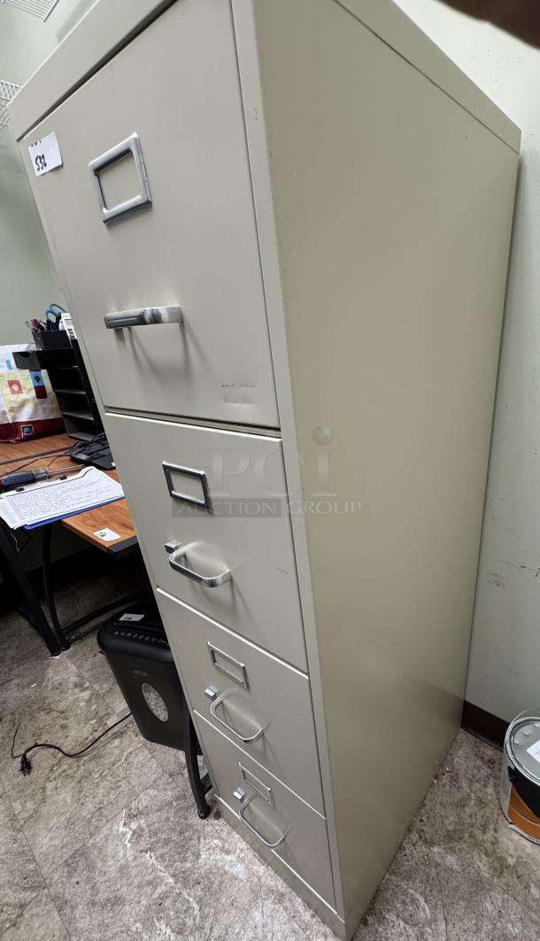 4-drawer beige filing cabinet without a key, featuring label holders and metal handles, in used condition.