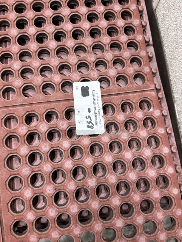 Red floor mats with hexagonal cutouts, dimensions 3'x3' and 5'x3'. Features auction label, good condition.