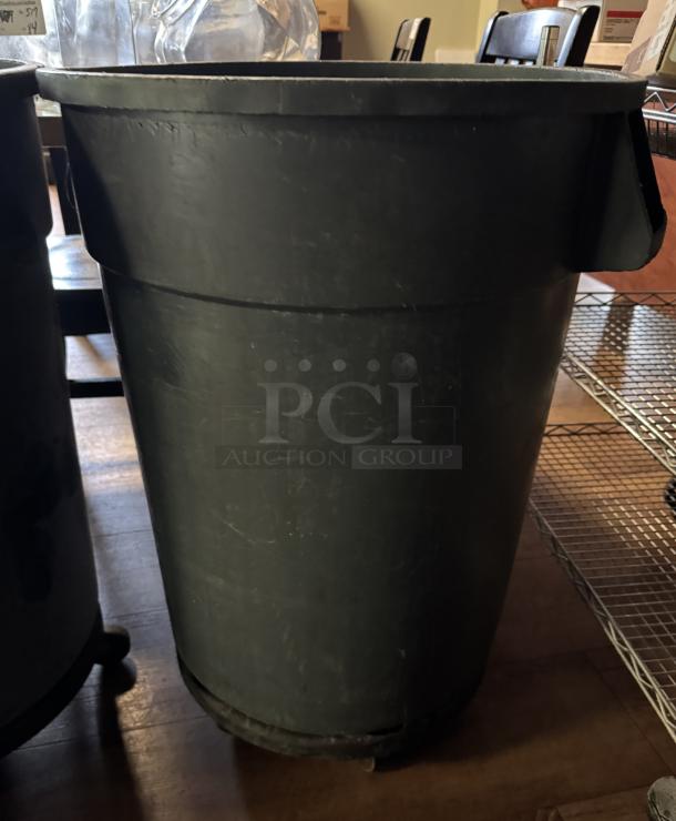 Large gray trash can on dolly, slightly worn; sturdy construction; ideal for commercial use; two available.