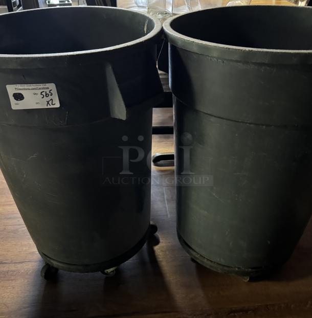 Large gray trash cans on dollies, set of two. Visible label reads "Qty: 2" and "XL." Used condition.