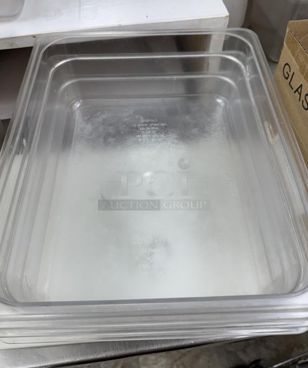 Cambro clear plastic containers with lids, set of 3. Excellent condition, visible brand marking, ideal for kitchen storage.