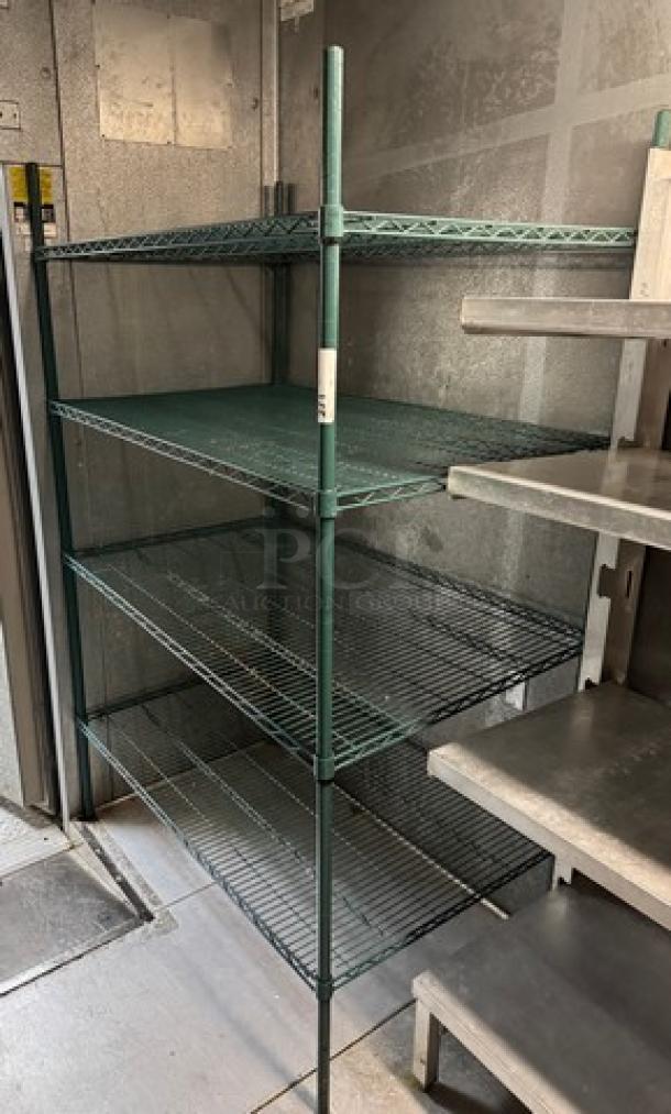 Green wire rack with four shelves, sturdy metal construction. Ideal for storage, in good condition.