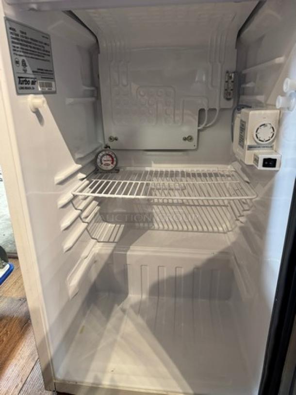 Turbo air refrigerated drink case, model TGM-5R, white interior, single wire shelf, 110V, tested and working, visible labels.