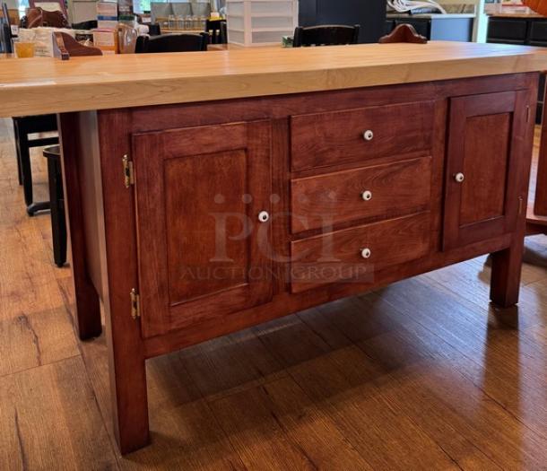 Amish made wooden storage cabinet with two doors, three drawers, and wood knobs. Excellent condition, rich brown finish, solid craftsmanship.