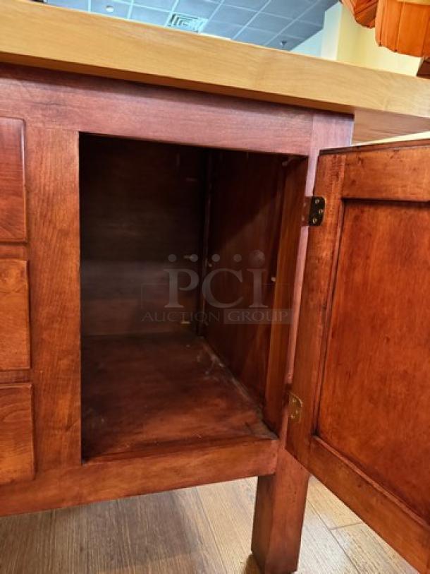 Amish made wooden storage cabinet in brown finish, open door reveals spacious interior, sturdy construction, excellent condition.