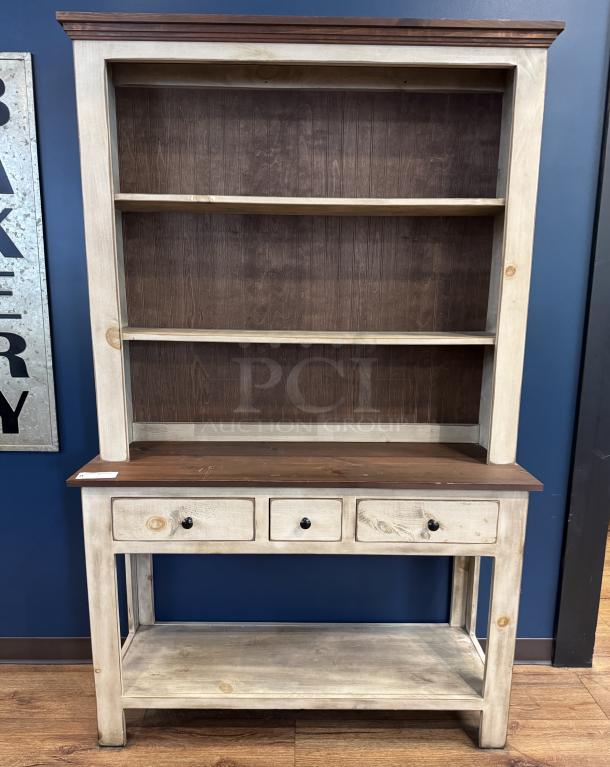 Wooden display hutch with three shelves, three drawers, and distressed finish. Two-tone wood; excellent condition.