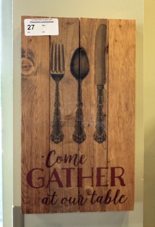 Wooden decorative picture with vintage silverware design and the phrase "Come Gather at Our Table." Auction tag visible.