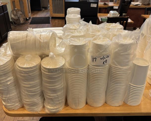 Disposable quart-size soup cups with lids, packaged in stacks of nine, new condition, labeled "17 w/lids x9."