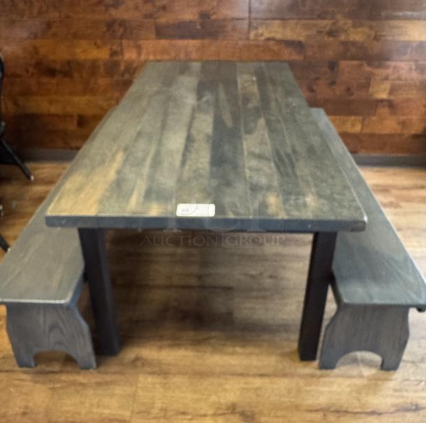 Amish made dining table with two matching bench seats, handcrafted wood, rustic finish, excellent condition.